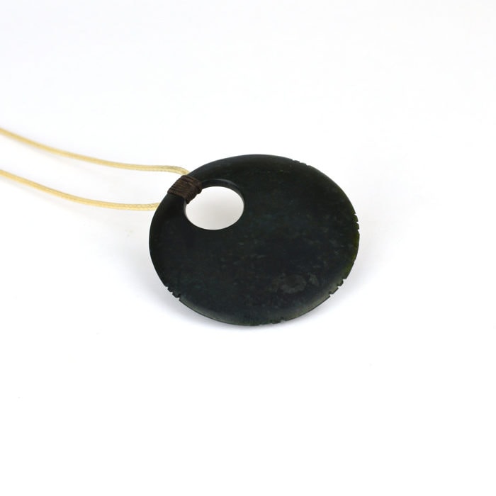 Tangwai disc pendant with whakapapa notches