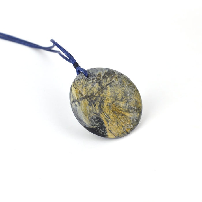 Chatoyant and Dendritic silver blue Tāwhirimātea pounamu disc pendant with yellow rind