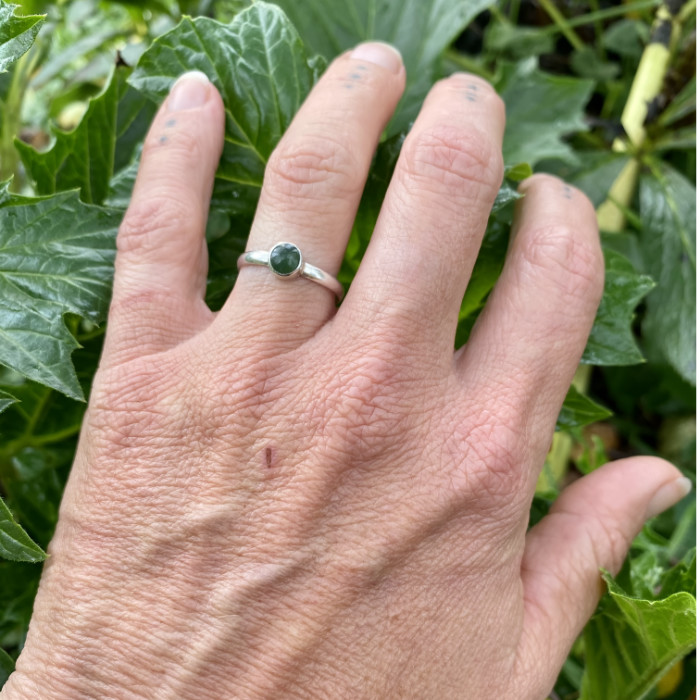 small pounamu ring on hand